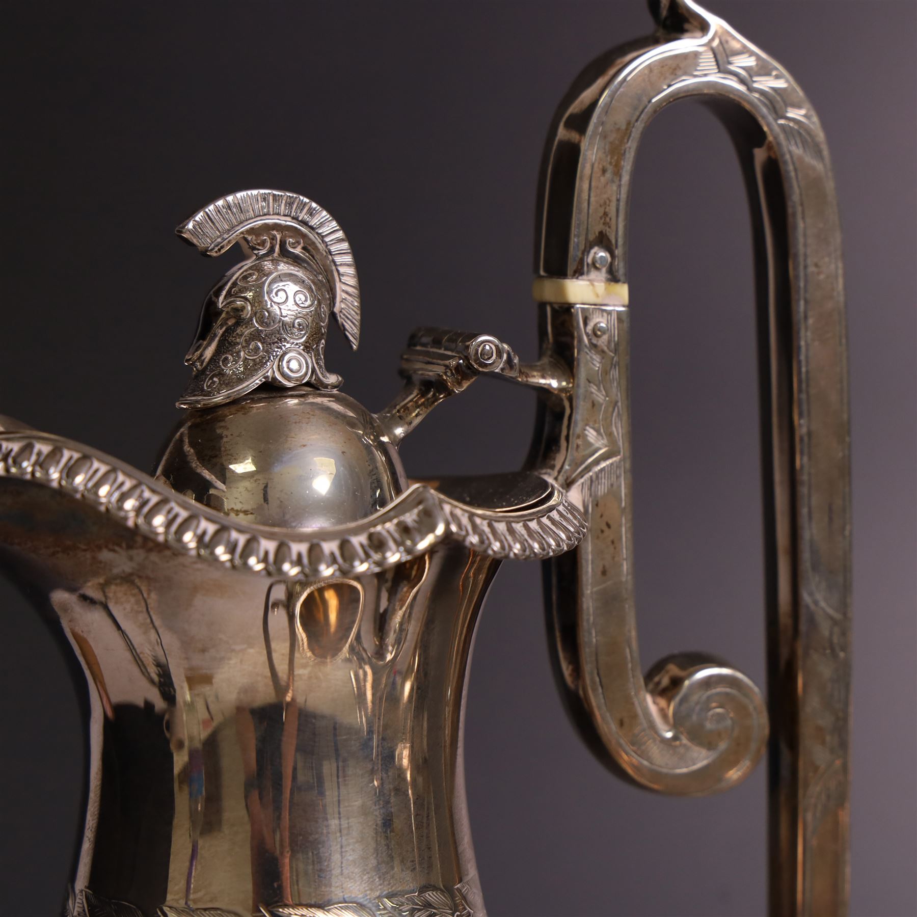 Early 20th century four piece silver tea service, comprising teapot, hot water pot, open sucrier and milk jug, all of oval bellied form with oblique gadrooned rim and upon four feet, the hotwater and teapot with wooden handles and finials, hallmarked William Lister & Sons, Sheffield 1912
