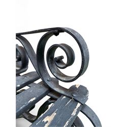 Coalbrookdale - rare pair of wrought iron and slatted wood garden benches, the twin wrought iron strapwork bench-ends formed of four scrolls over splayed feet, number 77 in the Coalbrookdale Castings Catalogue (see illustration)