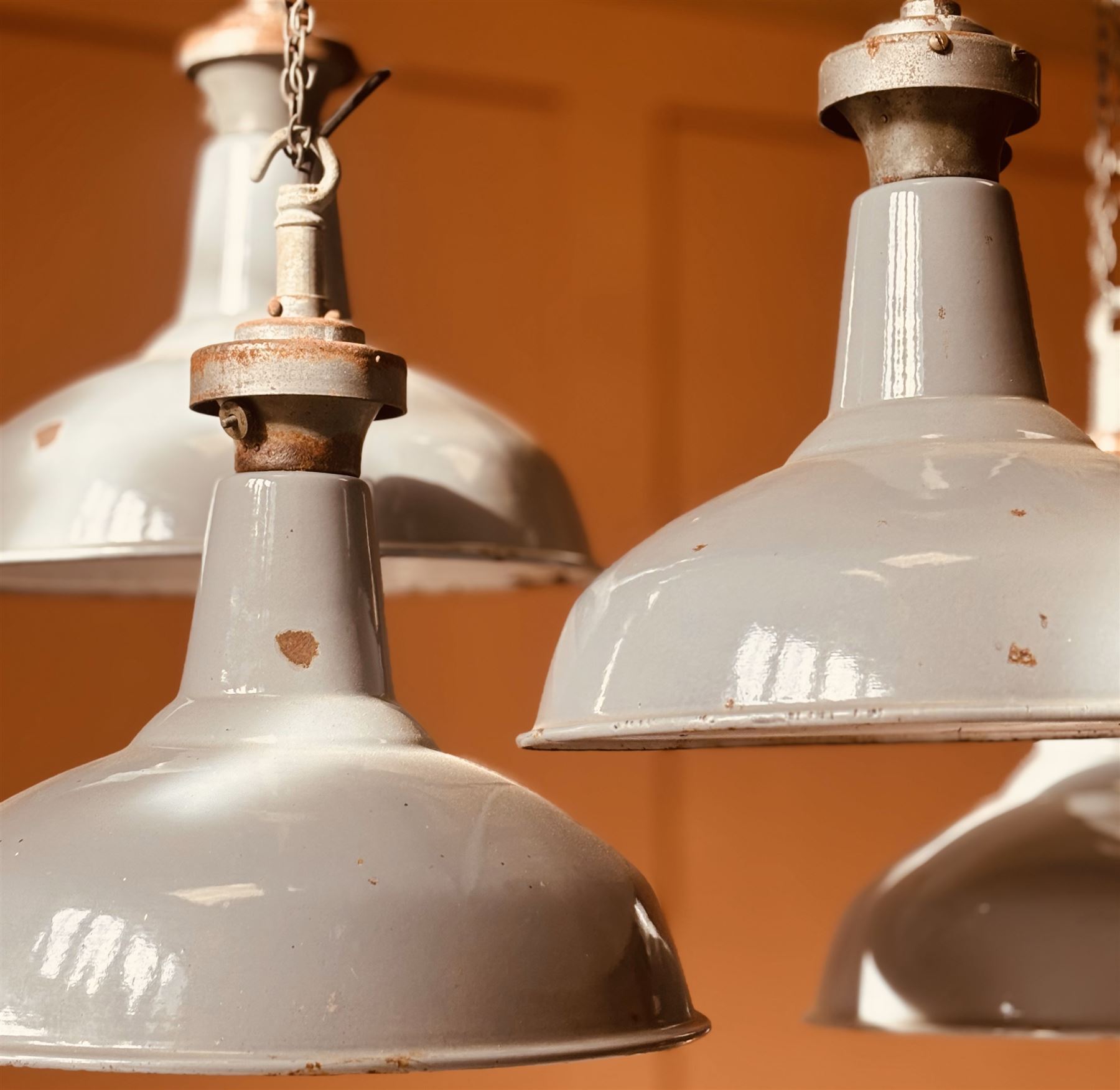 Set of four industrial grey enamel pendent light fittings, mid 20th century. H48cm, D41cm.  - COLLECTION BY APPOINTMENT FROM: The White House, Thirsk Road, Easingwold, York, YO61 3NF - CALL 01723 507111 TO ARRANGE
