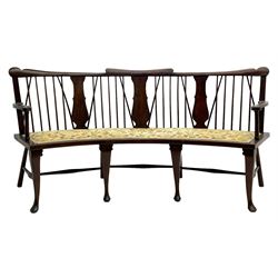 Georgian design curved Windsor settee or settle, shaped cresting rail over triple vase shaped splats and stick back, upholstered seat, on cabriole front supports joined by a series of swell turned stretchers
