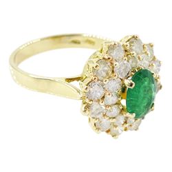 14ct gold emerald and diamond cluster ring, single oval cut emerald of approx 1.05 carat, surrounded by two rows of twenty four round brilliant cut light yellow diamonds, total diamond weight approx 2.35 carat