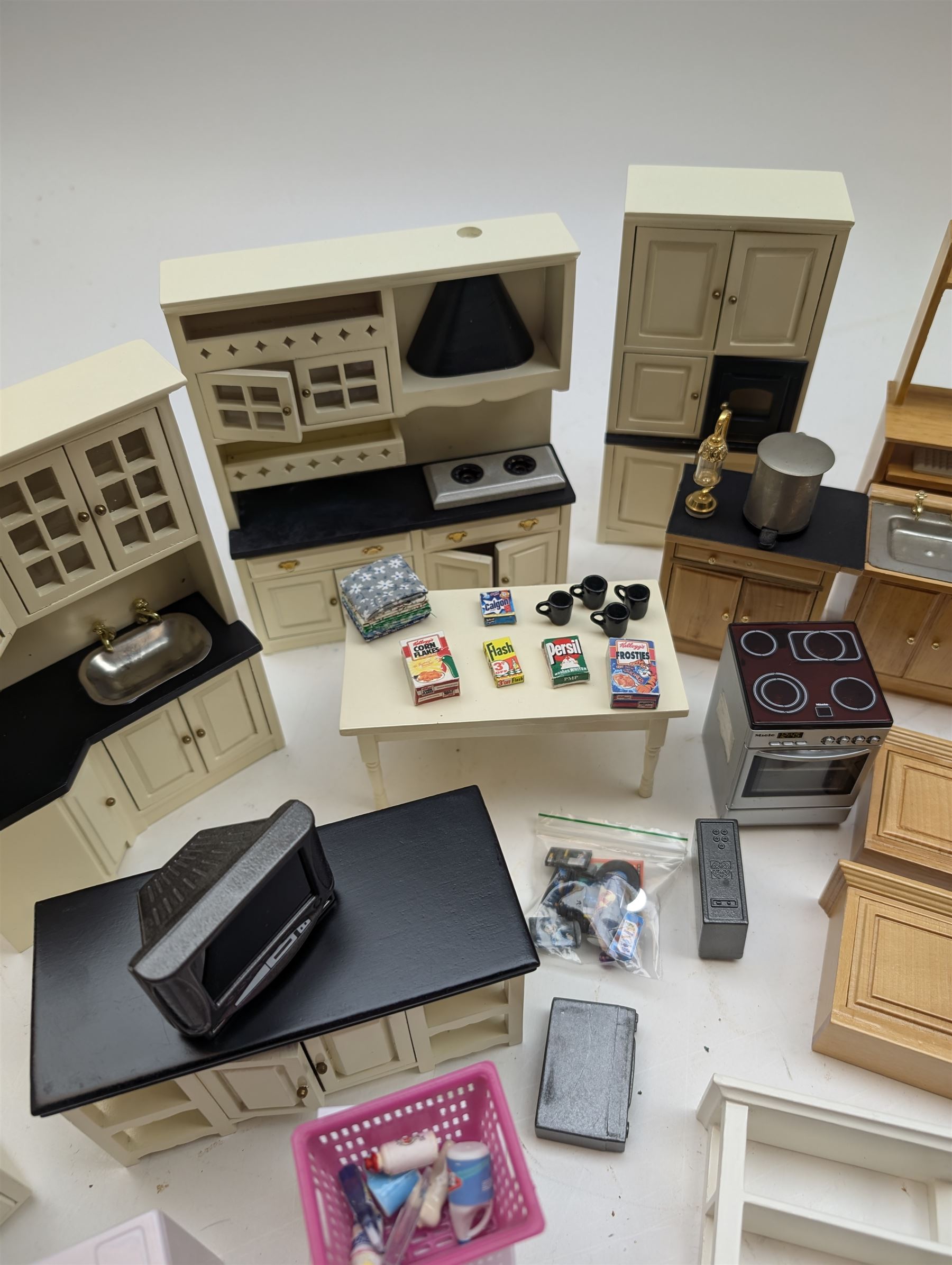Modern 1:12 scale dolls house furniture, comprising pine kitchen set, with wall cabinets, floor cabinets and sink unit, white wooden bathroom suite, white wooden kitchen and dining room furniture and appliances, wooden bedroom furniture, Raine purple wingback chair, tv, desk, fish tank, etc
