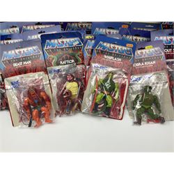 Thirty-one Masters of the Universe He-Man figures re-bagged on original backing cards;  two others lacking backing cards; boxed Modulok figure; bag of weapons and accessories; Roton, two horses and two battle cats; 1986 & 1987 Annuals; Ladybird and other story books; Panini sticker album; instructions etc