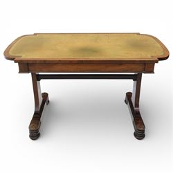 William IV mahogany library table, rectangular top with rounded edges inset with gilt and blind tooled leather writing surface, fitted with opposing frieze drawers, raised upon shaped trestle end supports united by a central upper stretcher, terminating in stylised bun feet with applied roundel bosses