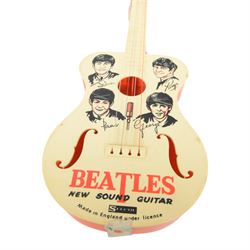 1960s Selcol 'The Beatles New Sound Guitar', plastic toy guitar, in brown faux fur case, H58.5cm