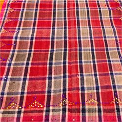 South West Persian Jajim kilim, field woven with a plaid design of intersecting bands in shades of red, terracotta, pink, and ochre, flanked by contrasting side panels decorated with small geometric tribal motifs the decoration incorporating raised wool details against flatwoven ground  