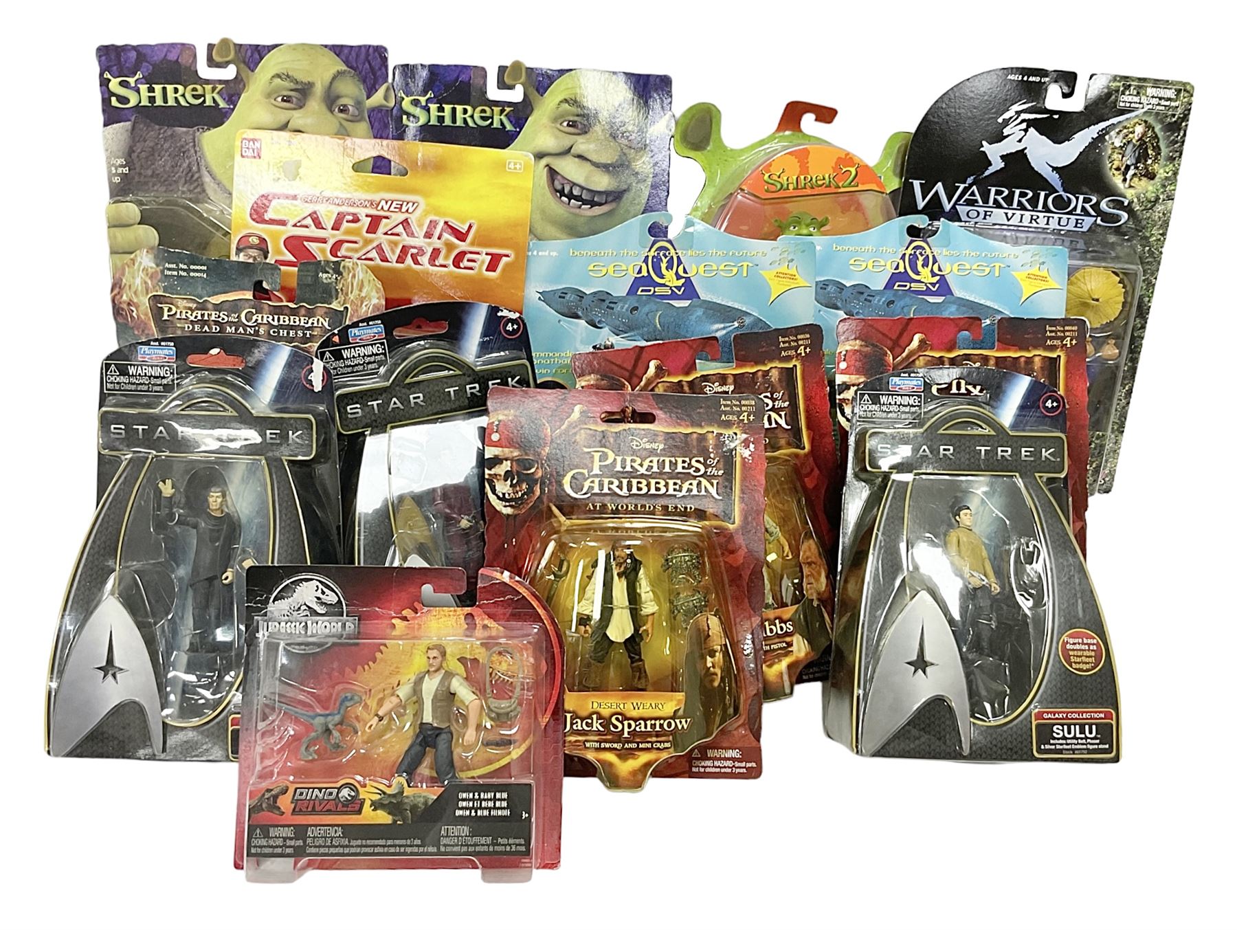 Seventeen TV & film related carded action figures comprising four Pirates of the Caribbean; five Shrek; three Star Trek; two Sea Quest DSV; Captain Scarlet, Warriors of Virtue; and Jurassic World; all in unopened blister packs (17)