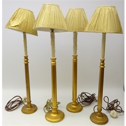  Two pairs of gilded candlestick table lamps with pleated shades, H82cm   