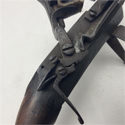 Late 18th/early 19th century flintlock tinder lighter, the steel box lock with hinged door to the left side, fruitwood butt with plain bar trigger, the left side set with a taper sconce and bipod front support, L21cm.