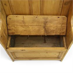 Victorian waxed pine settle or hall bench, shaped cresting rail over double panelled back, outswept arms on hinged box-seat, on end supports