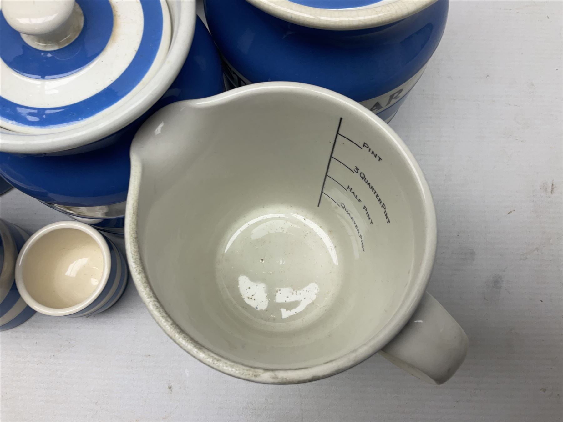 TG Green Cornish kitchen ware, to include coffee pot, pint milk jug, nine storage jars for various items, four dinner plates, etc (25)