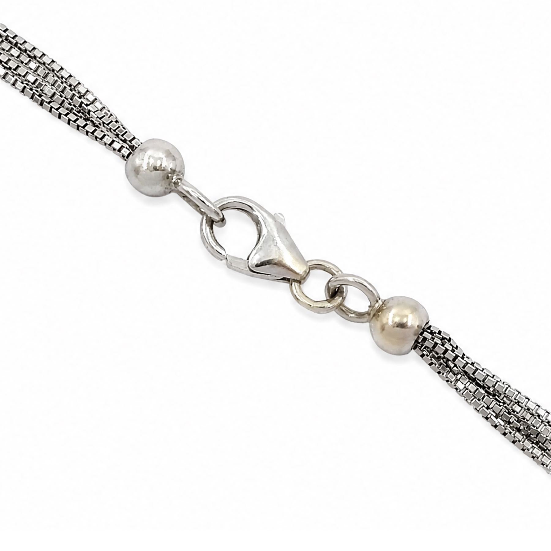 18ct white gold multi gemstone cross pendant necklace, vari-cut stones including emerald, ruby, pink and blue sapphire, red and blue stones, on a four strand box link chain necklace, stamped 750