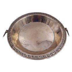 Middle Eastern silver dish, of circular form with foliate chased border to rim and twin lion mask ring handles, D28cm, unmarked but testing as silver, approximate weight 22.24 ozt (692 grams)
