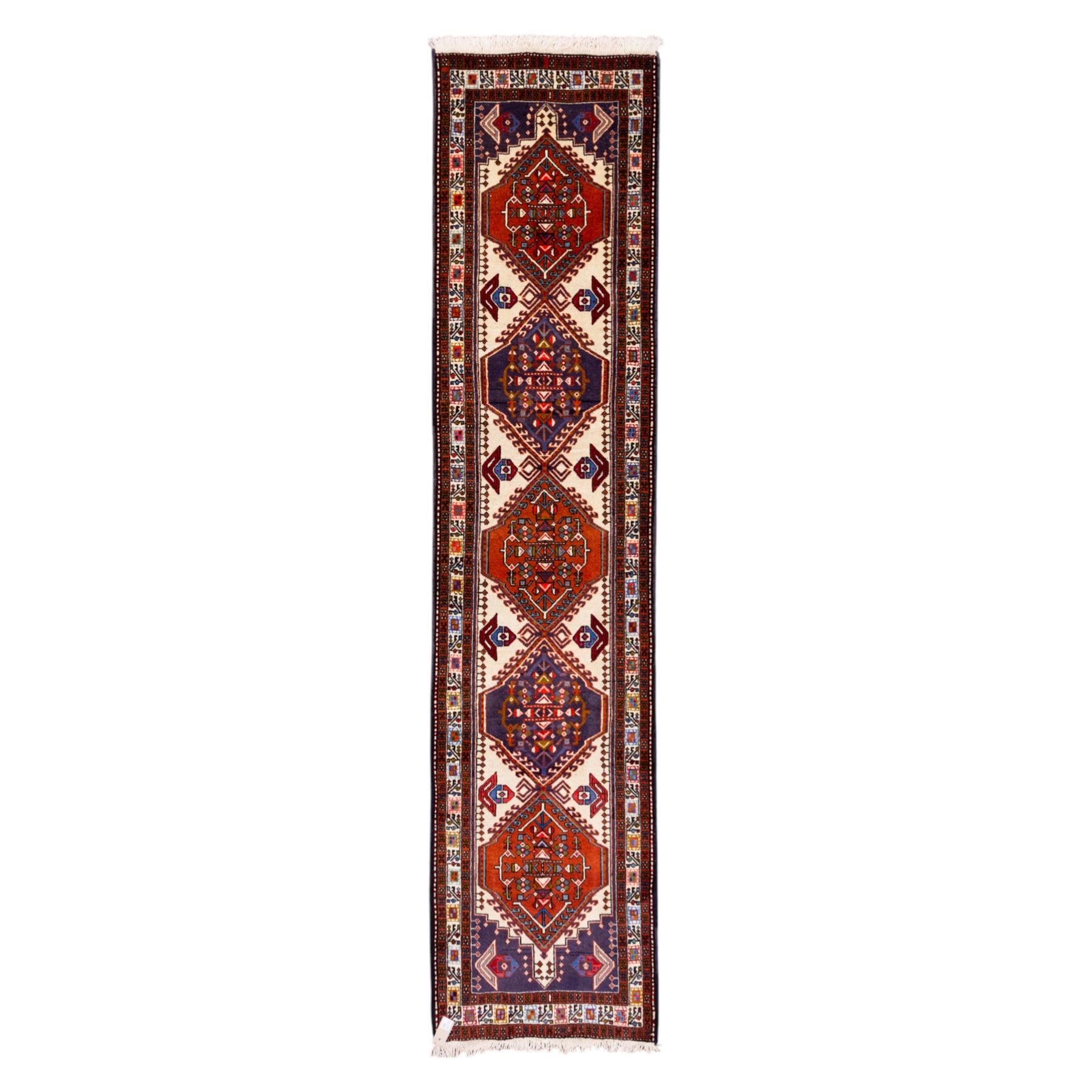 North West Persian Ardebil hand-knotted runner, ivory field decorated with row of large hexagonal medallions enclosing stylized geometric and floral motifs, linked by angular devices, within multiple geometric borders, cotton fringe ends 