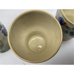 Early 20th century Royal Doulton Brangwyn Ware jug and set of six beakers, designed by Frank Brangwyn RA, all decorated in the Harvest pattern with stylised leaves and fruit on mottled peach and green ground, all with printed marks beneath, date code for 1920s, largest H18cm