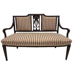 Edwardian mahogany framed three-piece salon suite - two-seat sofa, stepped cresting rail over acanthus and scroll carved pierced splat, upholstered in striped fabric (W124cm, H87cm, D62cm); and a pair of matching armchairs (W60cm) 