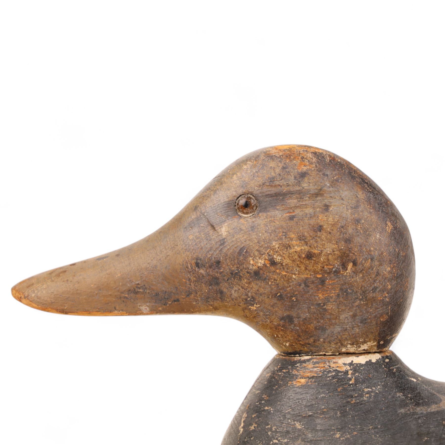 Early 20th century American carved wooden decoy duck, with weight beneath marked CJ Raymond Lead Co Chicago, H19cm, L40cm