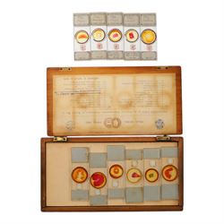 Late 19th/early 20th century Negretti and Zambra London brass microscope, with lenses, in mahogany travel case, together with a small brass field microscope and a set of prepared specimen slides