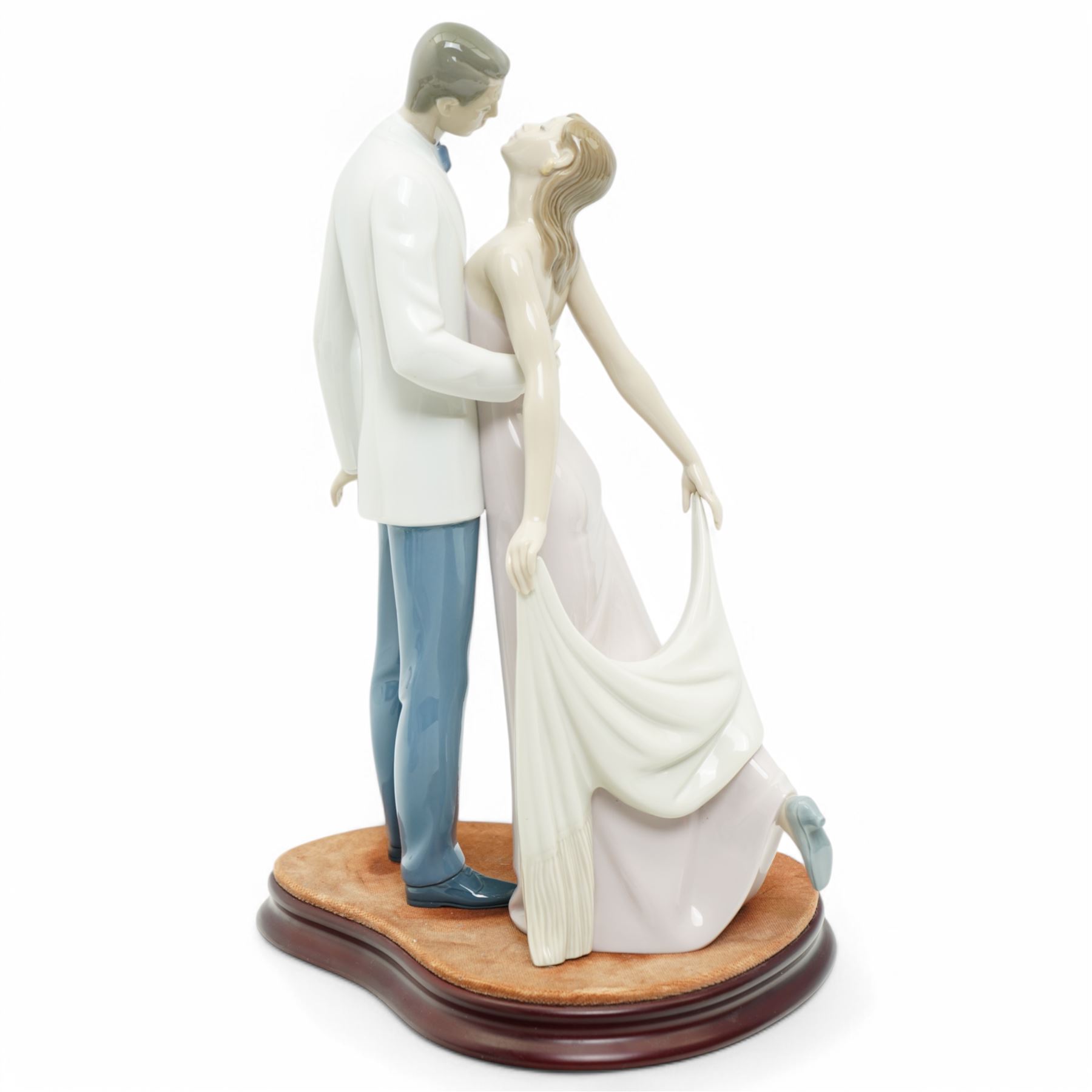 Two Lladro figures, comprising First Melodies 6475 and Happy Anniversary 8292, with one Nadal ballerina, all boxed, tallest H31cm excluding base (3)