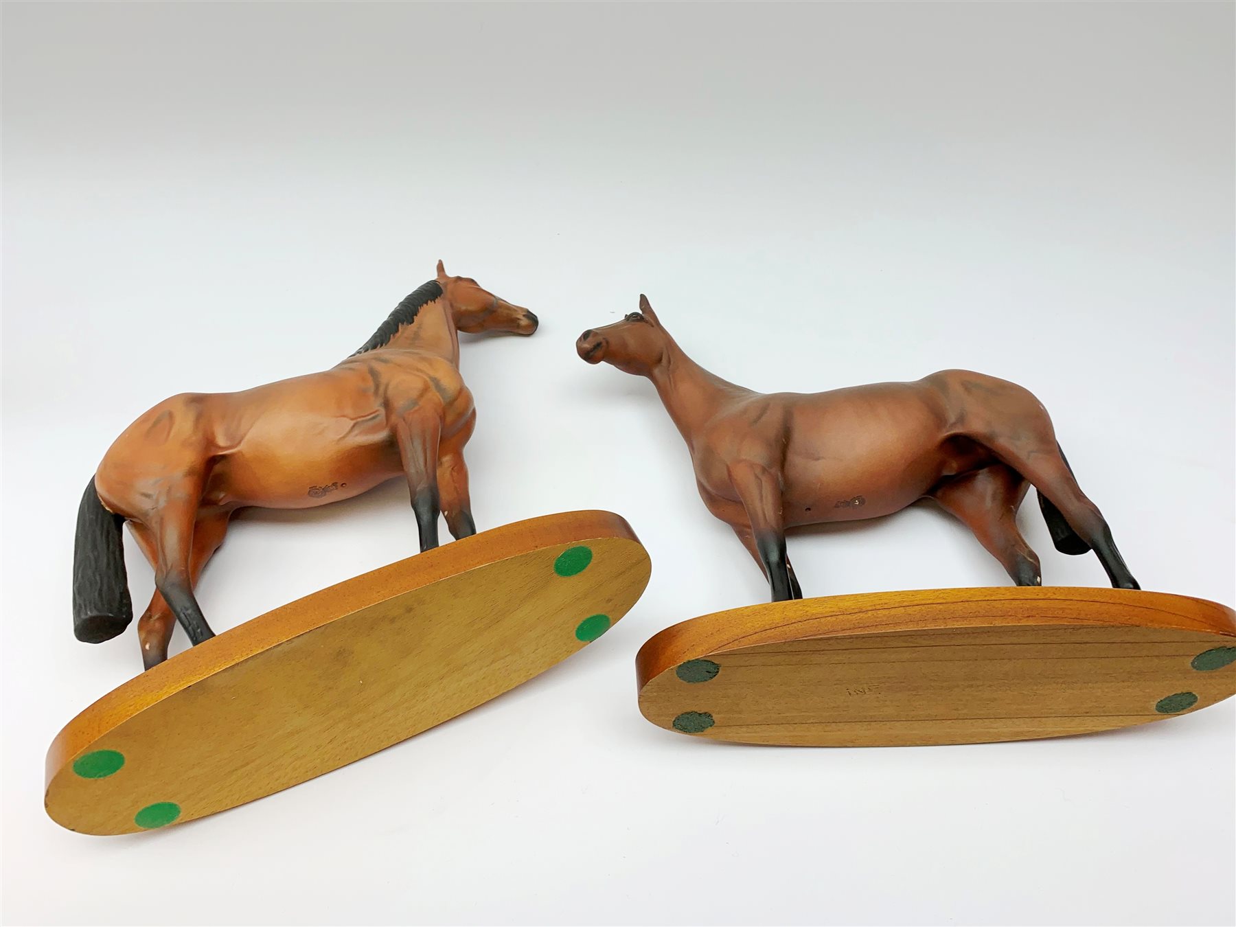 Four Royal Doulton horse figurines, comprising Red Rum, Arkle, and the Winner DA154, and another modelled as a prancing bay horse, largest H32cm. (4). 