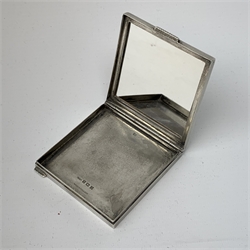 Silver and enamel compact, of square form with engine turned decoration to the sides and back, the hinged cover with inset enamel panel depicting an exotic bird within a surround of trailing vines, opening to reveal a mirror beneath, hallmarked Henry Clifford Davis, Birmingham 1950, 7.5cm x 7.5cm
