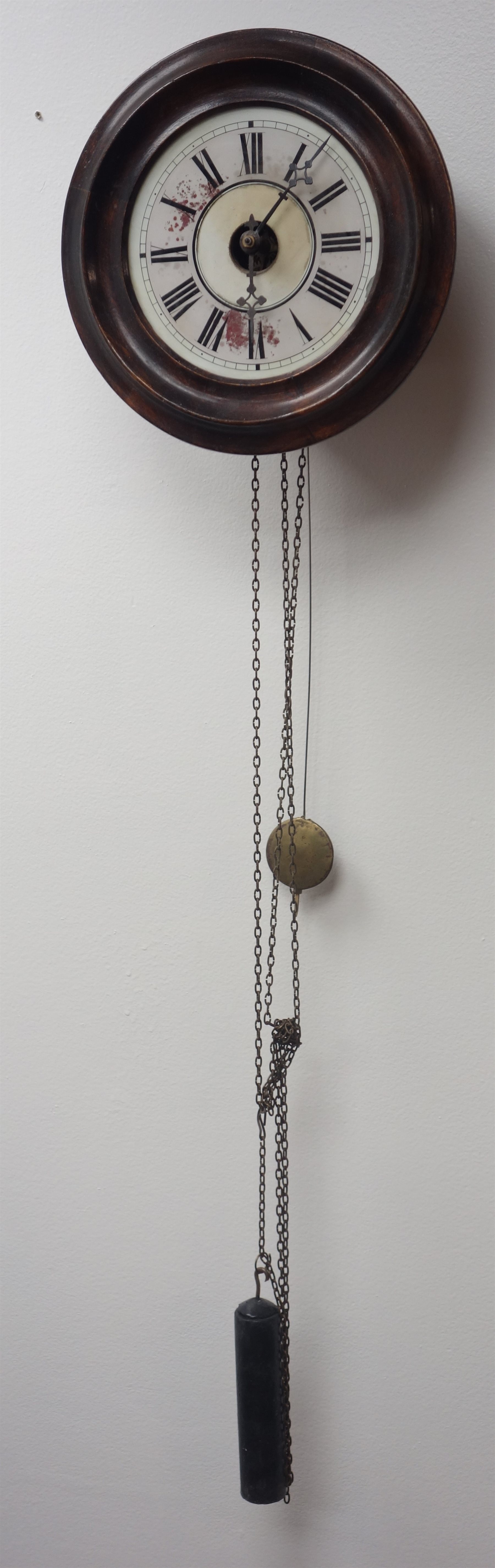 Early 20th century wall hanging postman's alarm clock, circular stained