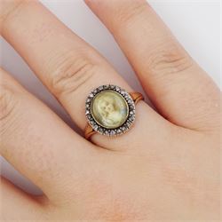 19th century French 18ct gold and silver diamond portrait ring, set with an oval miniature of a woman in 18th century dress on ivory, under a glazed panel, with rose cut diamond surround and trifurcated shoulders, hallmarked. This lot has been registered for sale under Section 10 of the APHA Ivory Act