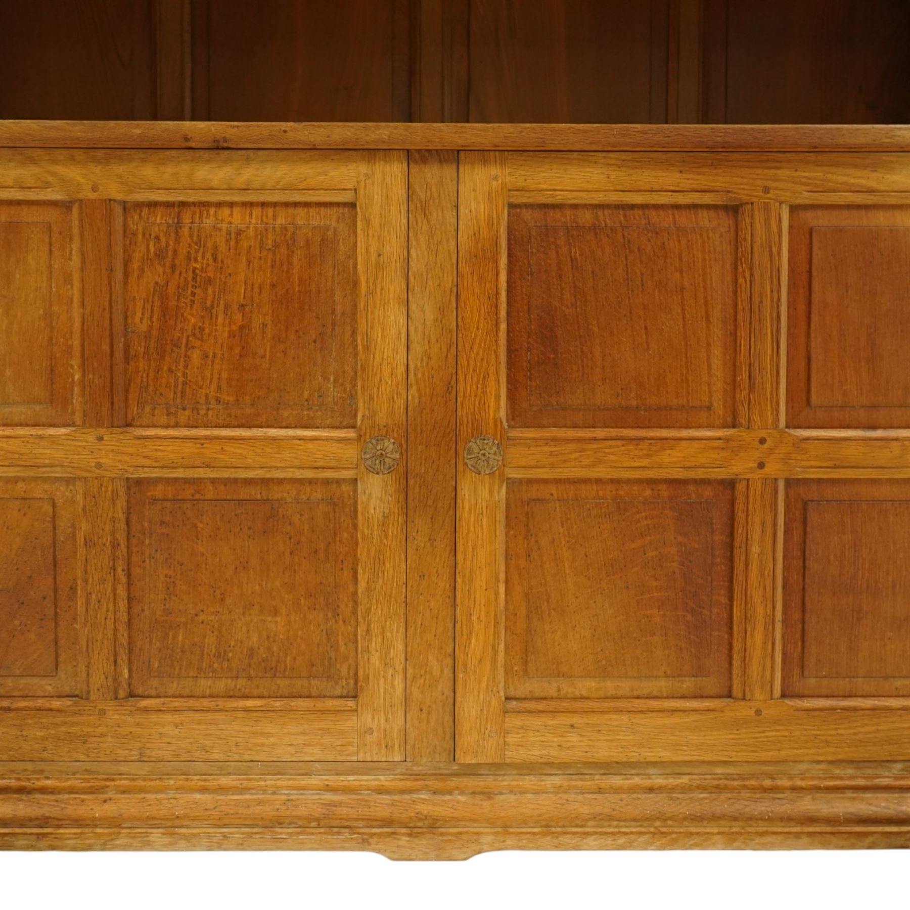 Beaverman - Yorkshire oak open bookcase, with adjustable shelves, panelled sides and lower cupboard doors, with carved beaver signature, by Colin Almack of Sutton near Thirsk