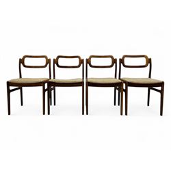 Johannes Andersen for Uldum Mobelfabrik - set of eight Danish teak dining chairs, each with open back rests with curved edges, upholstered seats in a neutral woven fabric, raised on tapered supports