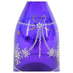 19th century style blue glass decanter and six drinking glasses, the decanter of mallet form with lozenge shaped stopper, all with white enamel and gilt swag decoration, decanter H34cm, drinking glasses H11.5cm