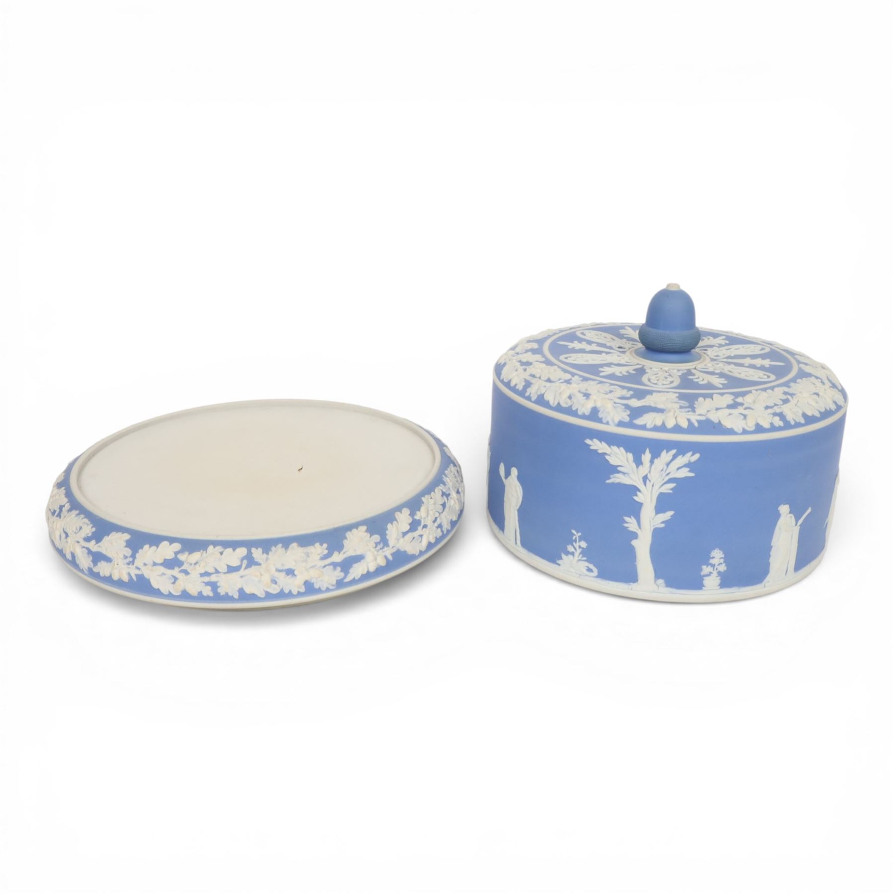 19th century Jasperware cheese dome decorated with classical figures in relief, with borders of oak leaves, with acorn finial, H22cm