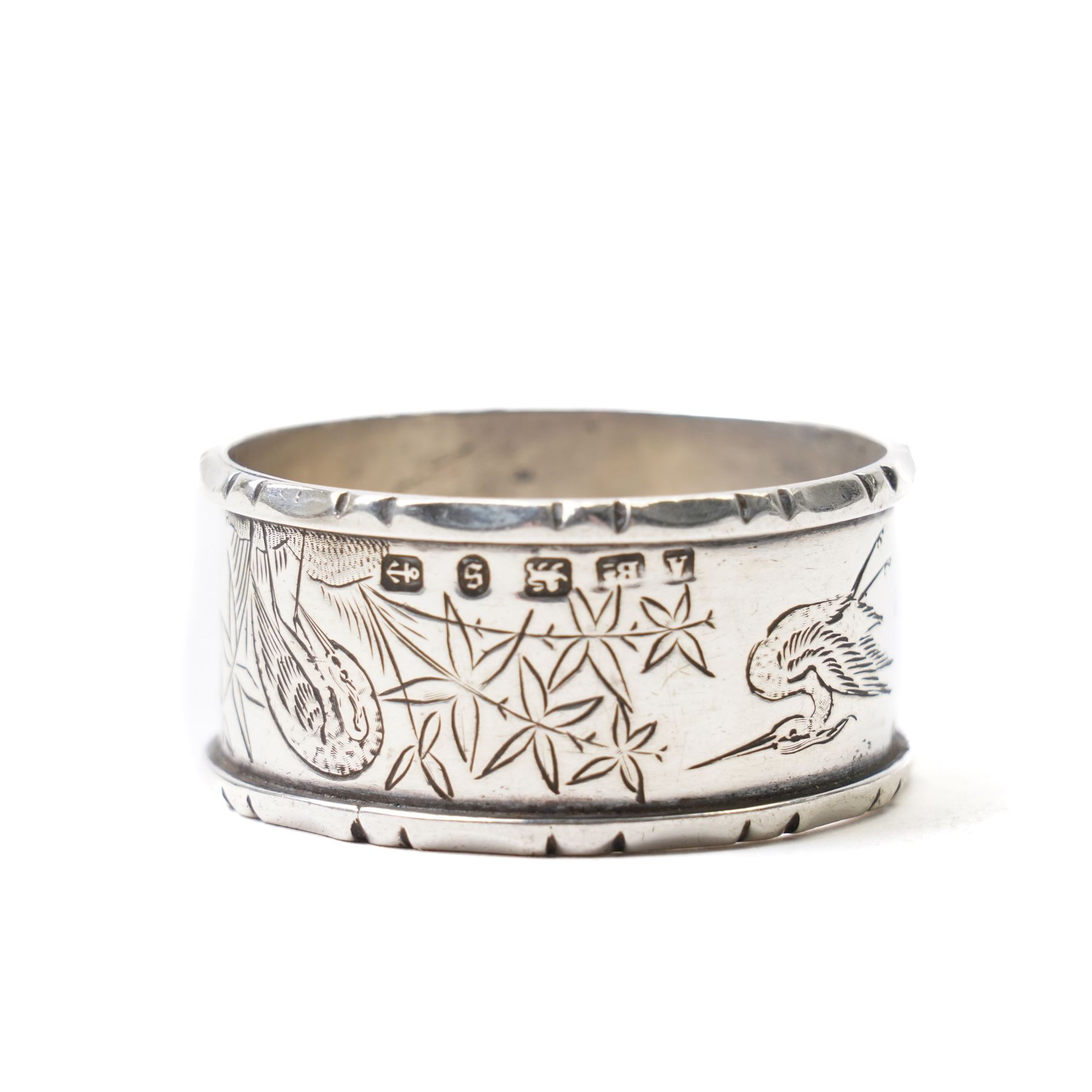Silver napkin ring with engraved decoration and silver mounted oak pepper mill