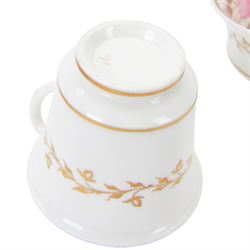 Minton trio, coffee cup, teacup and saucer, circa 1824, moulded ribbed detail, distinctive 'N' handle, painted in pattern no 139, with floral sprays and lilac blue band, coffee cup including handle H8cm, saucer D14cm, together with a Spode trio, coffee cup, teacup and saucer, circa 1830, decorated in the 3886 pattern, painted with pink cabbage roses and heightened with gilt, coffee cup including handle H8cm, saucer D15cm