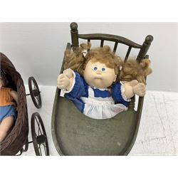Green painted metamorphic high chair, wicker pram and two dolls including a Cabbage Patch doll
