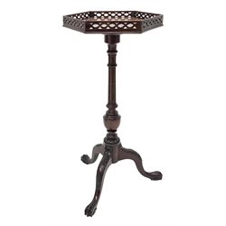 Small Georgian style mahogany tripod wine table, figured hexagonal top with pierced gallery, turned and fluted column, three out splayed leaf carved supports with paw feet, D34cm, H69cm