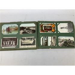 Album containing approximately three hundred Edwardian and later postcards including Louis Wain, hold-to-the-light, comic, WW1 soldiers, glamour, British and Foreign topographical including real photographic and local, novelty pull-out, shipping etc