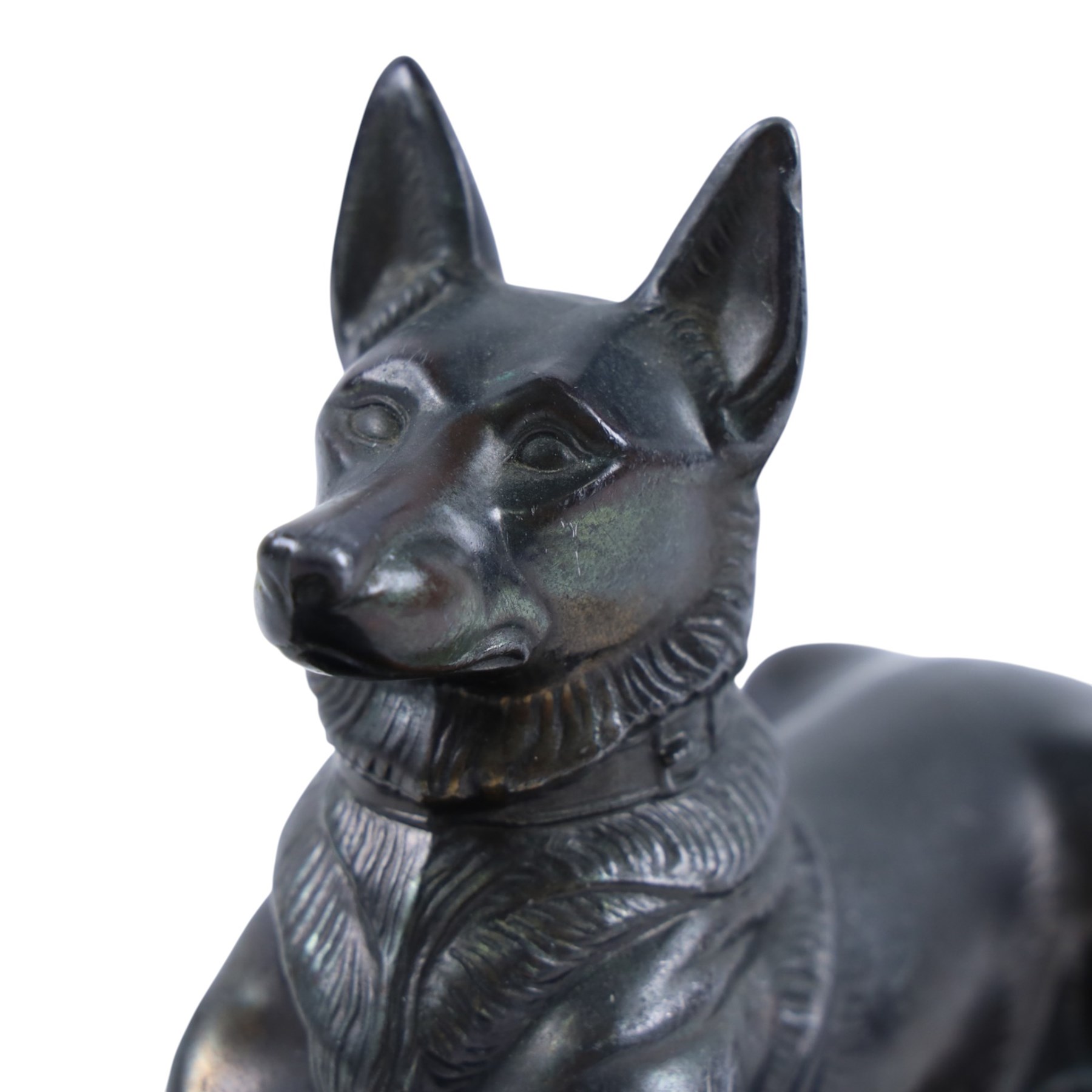 French Art Deco spelter figure of a recumbent dog on marble and onyx plinth, H14cm, L30cm