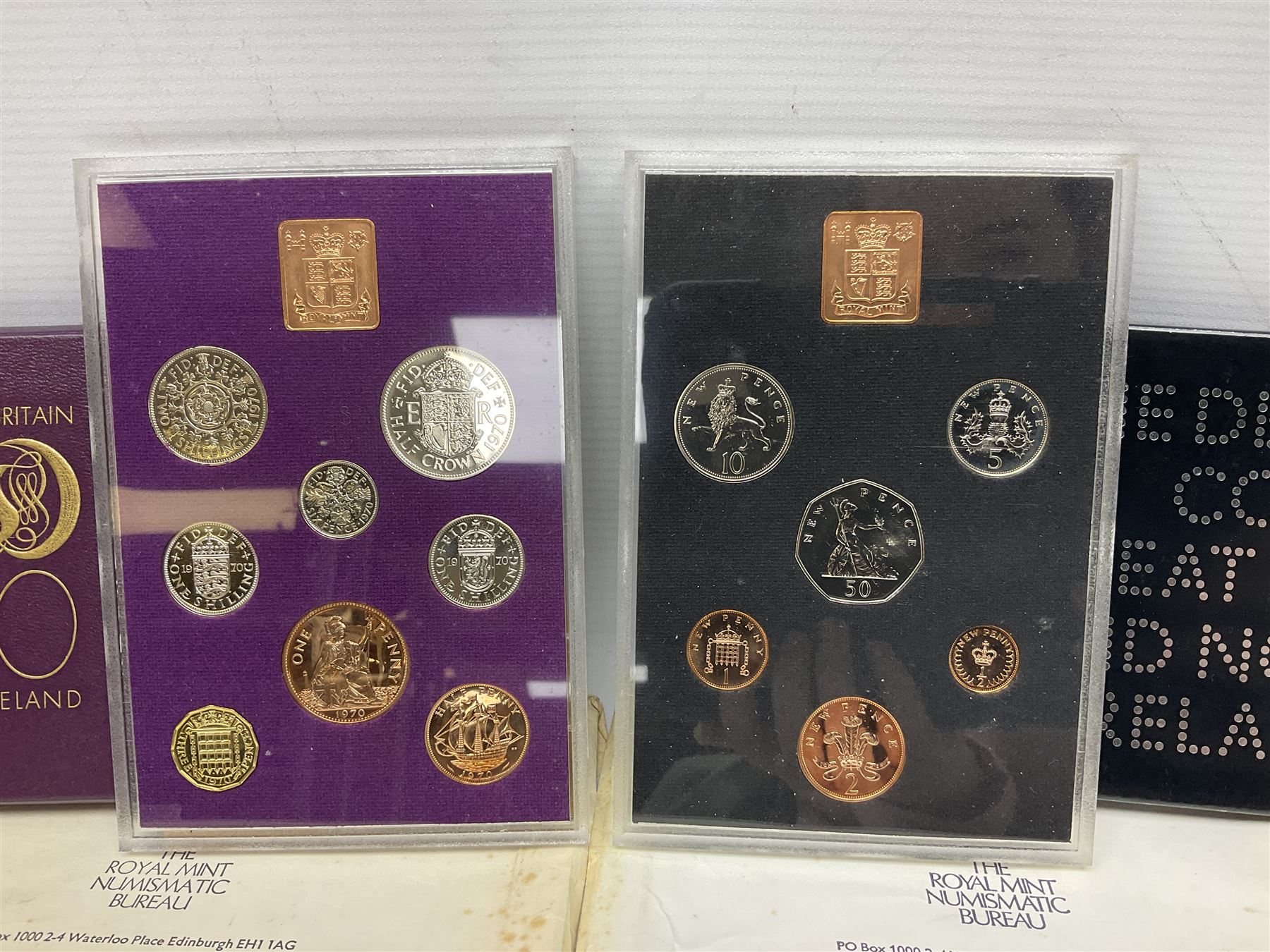 Two Great Britain and Northern Island proof sets dated 1970 and 1971, both with card cases, three 1986 Commonwealth Games commemorative two pound coins, in card folders, and six brilliant uncirculated one pound coins, in card folders