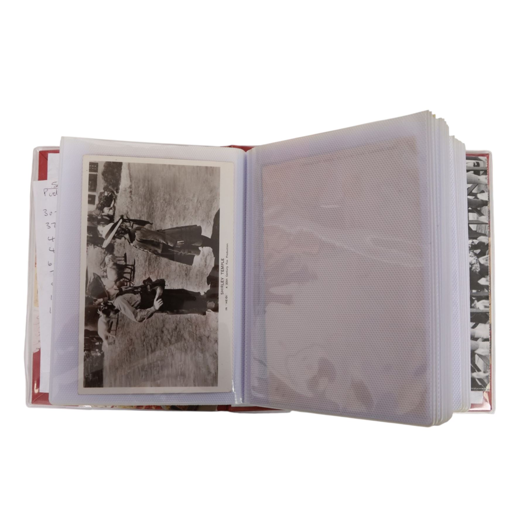 Collection of photographs and postcards, mostly depicting 1940s film stars, including some autographed examples and some with printed signatures, together with a collection of Shirley Temple  promotional photographs,1930s autograph album and postcards of the Royal Family