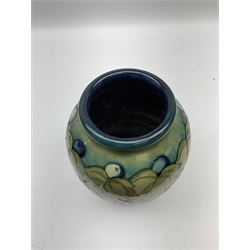 Moorcroft Grape and Leaf pattern baluster vase on green and blue ground, with impressed and painted mark beneath, H24cm