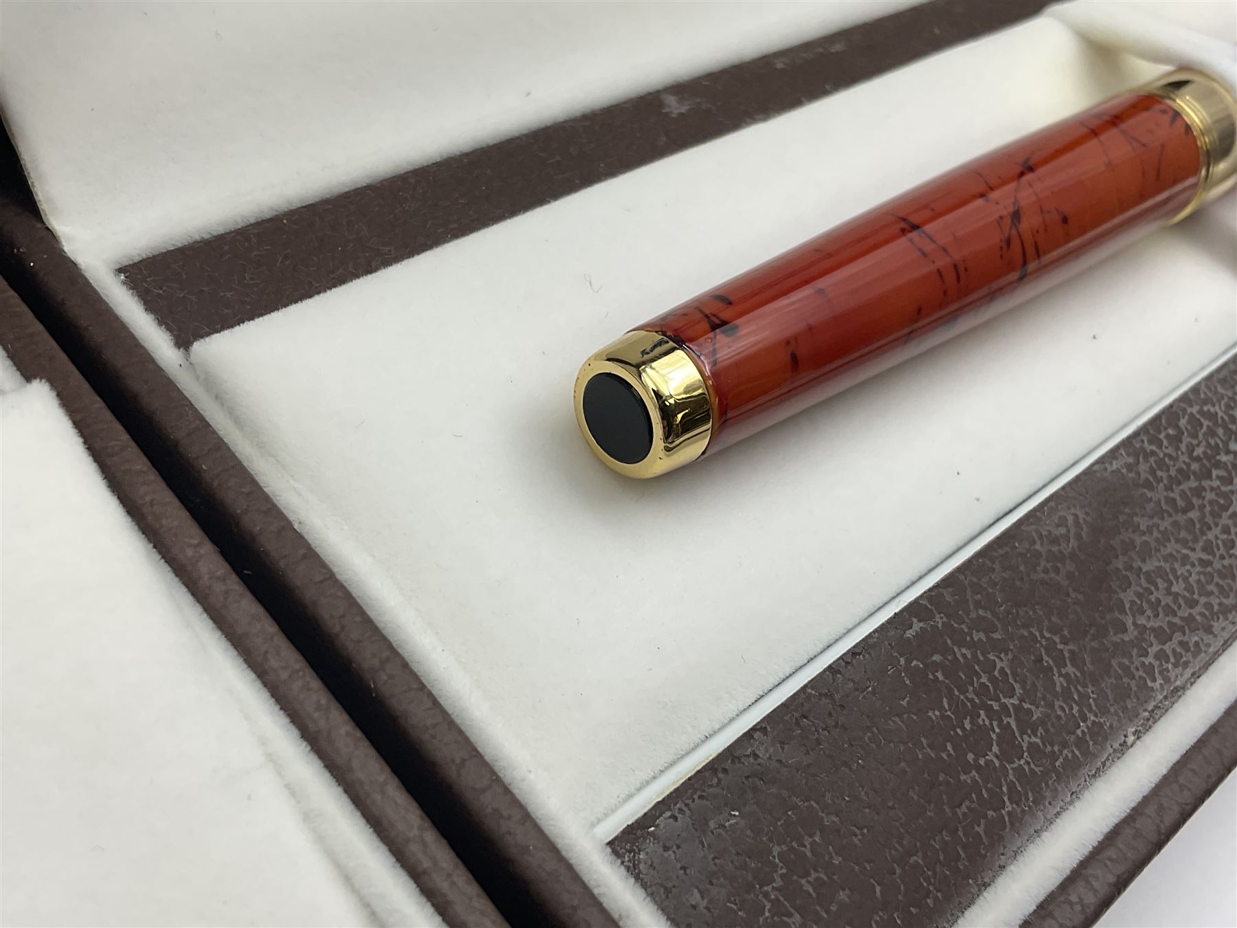 Circa 1930s Mentmore Auto Flow button fill fountain pen, the black barrel and cap with single narrow band and gold nib stamped Osmi Ridium 14ct, together with two gold nib fountain pens, each marked Huahong, the first stamped 14K 580, and second stamped 8K, both housed in Mentmore boxes (3)