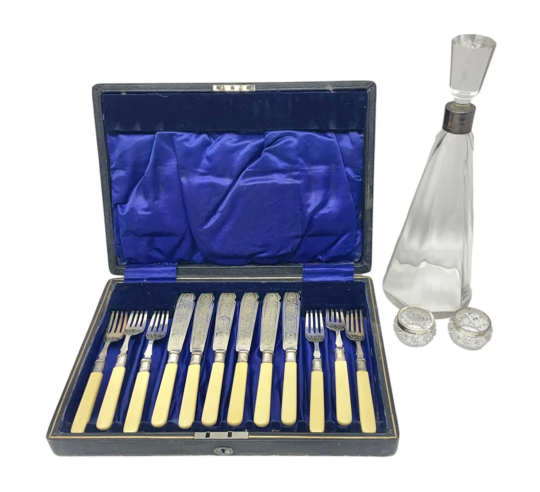 Set of six EPNS fish knives and forks with ivorine handles and hallmarked silver ferrules, boxed, together with a tapering glass decanter with hallmarked silver collar and pair of cut glass salts with hallmarked silver collars, decanter H32cm