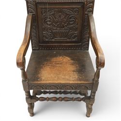 17th century style carved oak Wainscott chair, intricately carved back, united by a turned stretcher