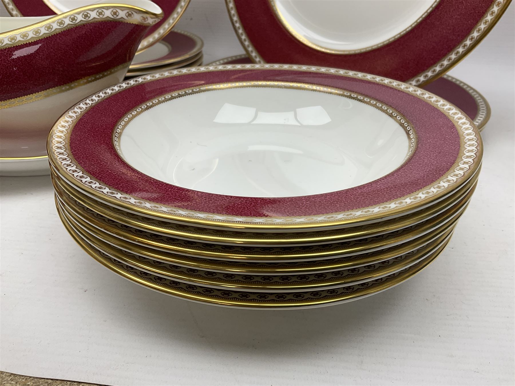 Wedgwood Ulander powder ruby pattern part dinner service, comprising six dinner plates, six side plates, six dessert plates, six soup bowls and sauce boat