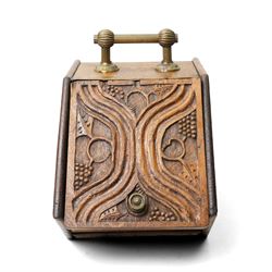 Arts & Crafts period oak coal box, each side carved with urn and spilling flowers, the cover with typical motifs, single carrying handle 
