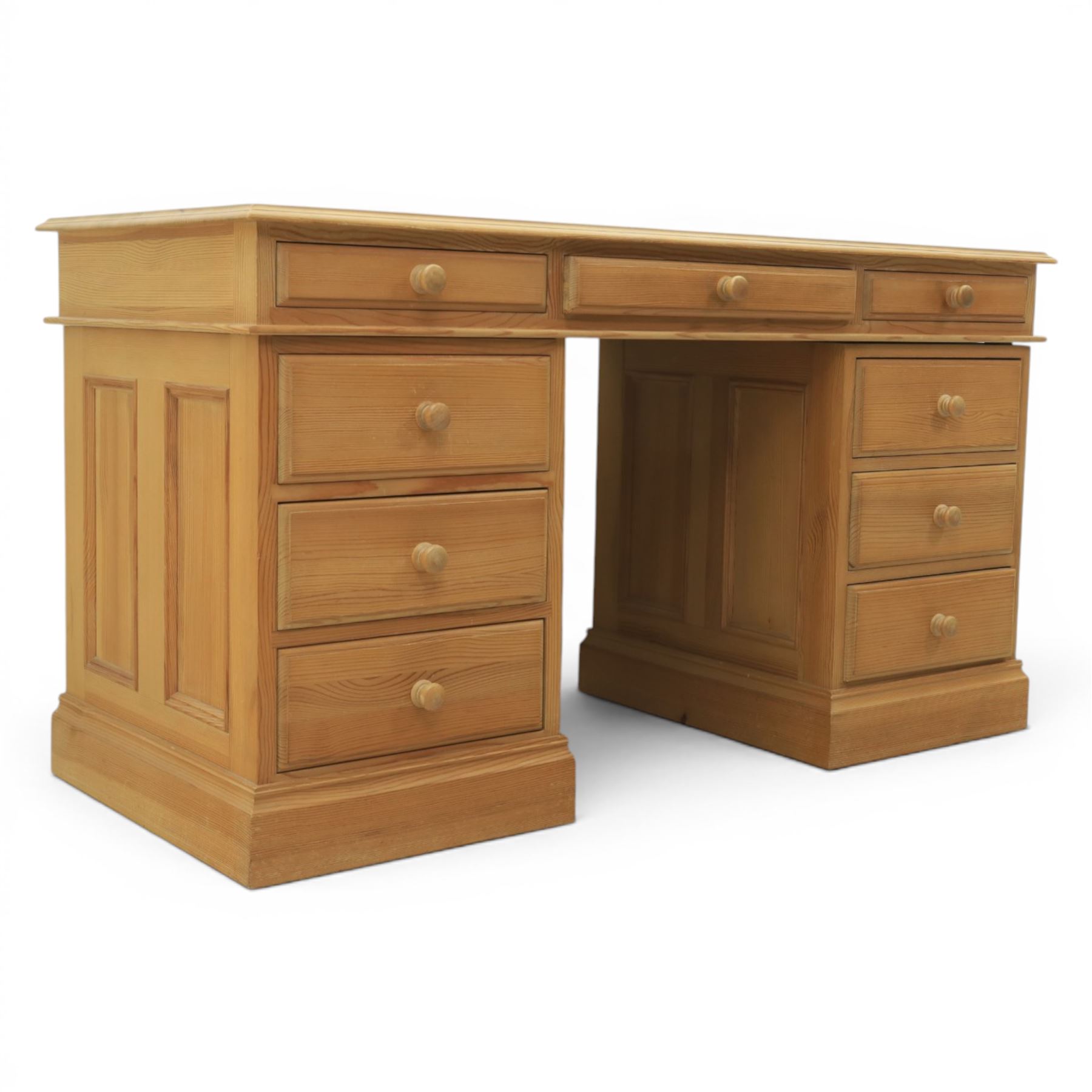 Solid pine twin pedestal desk, fitted with nine drawers, fielded panelled sides
