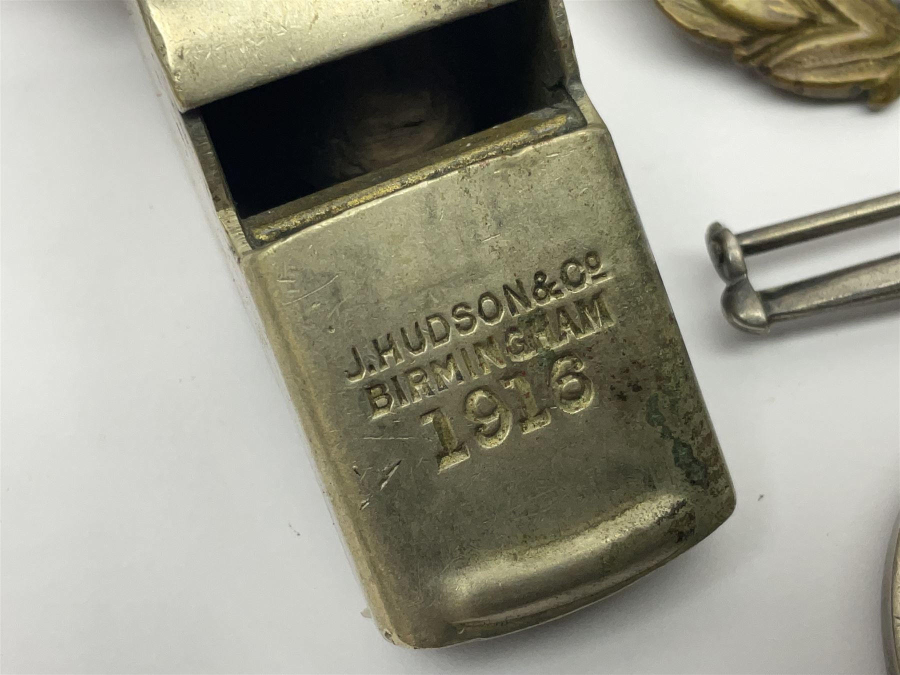 WWI J. Hudson & Co. Birmingham trench whistle dated 1916; WWI British War Medal awarded to 117363 Gnr. N.L. Wright R.A.; Services Rendered badge No.111643; RAF & RFC cap badges etc