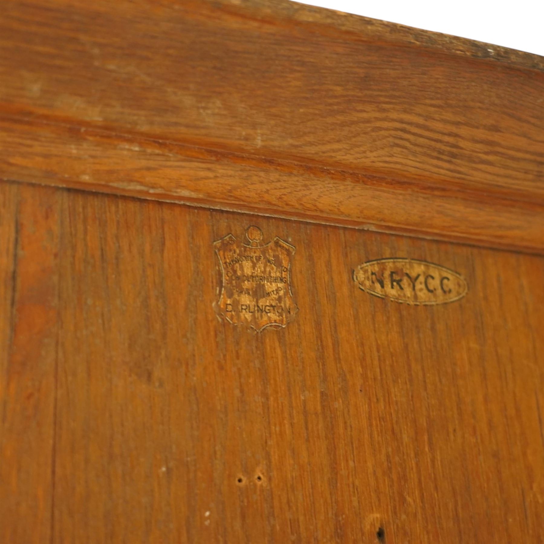 Early 20th century Arts and Crafts oak housekeeper’s cupboard, moulded cornice above pair of panelled doors enclosing a shelved interior, on plinth base
