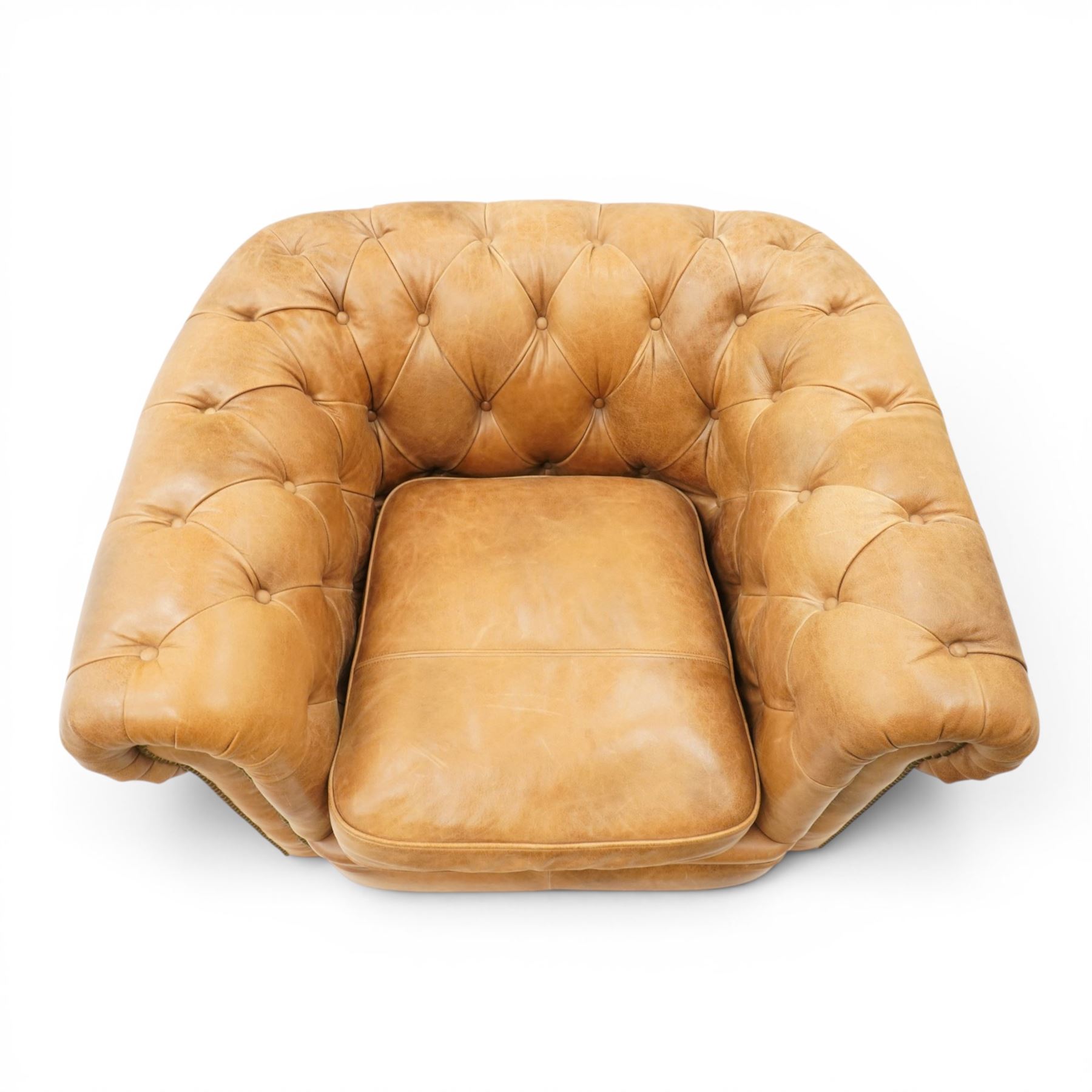 Alexander James - Chesterfield tan armchair, button backed with scrolled arms, brass studded trim raised on light wood turned feet