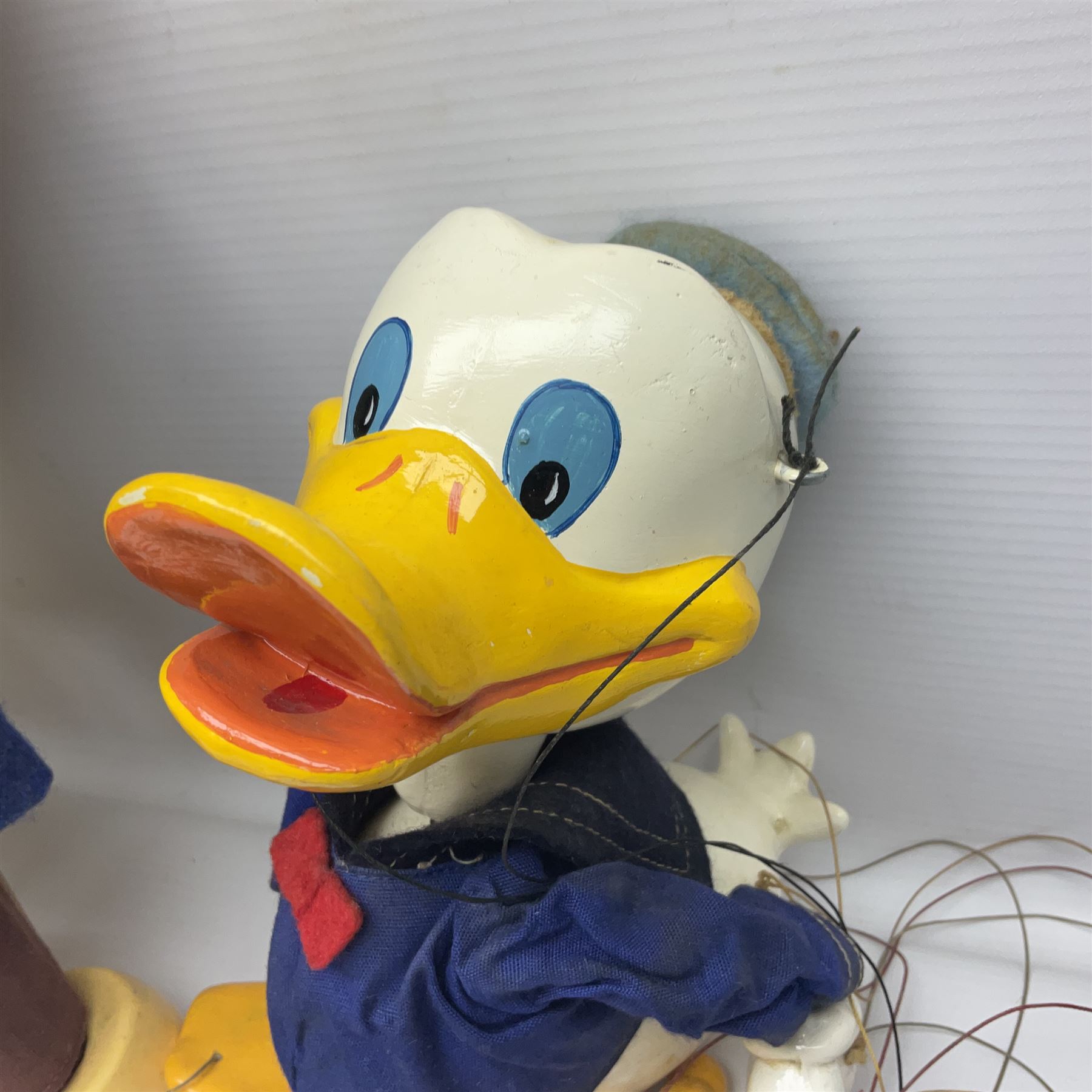 Two Pelham Puppets - The Magic Roundabout Mr. Rusty pole puppet with wool hands and blue  coat dated 1963; boxed; and Type SL Disney Donald Duck; unboxed (2)